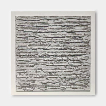 The image is a square-shaped abstract artwork with a textured, metallic appearance. The artwork features a repeating pattern of lines and curves, creating a sense of movement and depth.