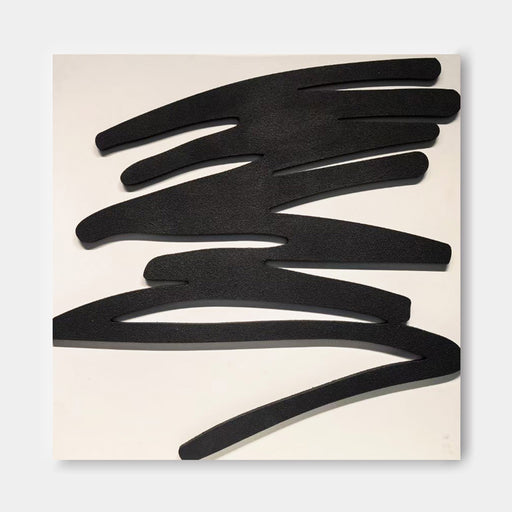 The image is a black and white abstract artwork consisting of various shapes and lines, including curved, jagged, and intersecting forms.
