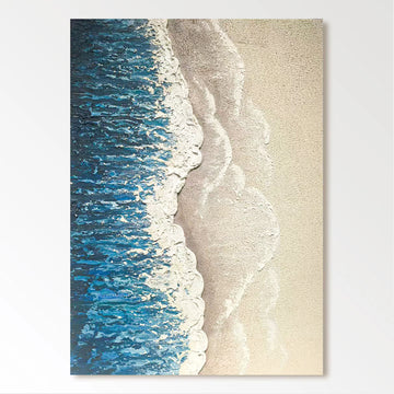 a serene beach scene with a wave gently lapping against the sandy shore.