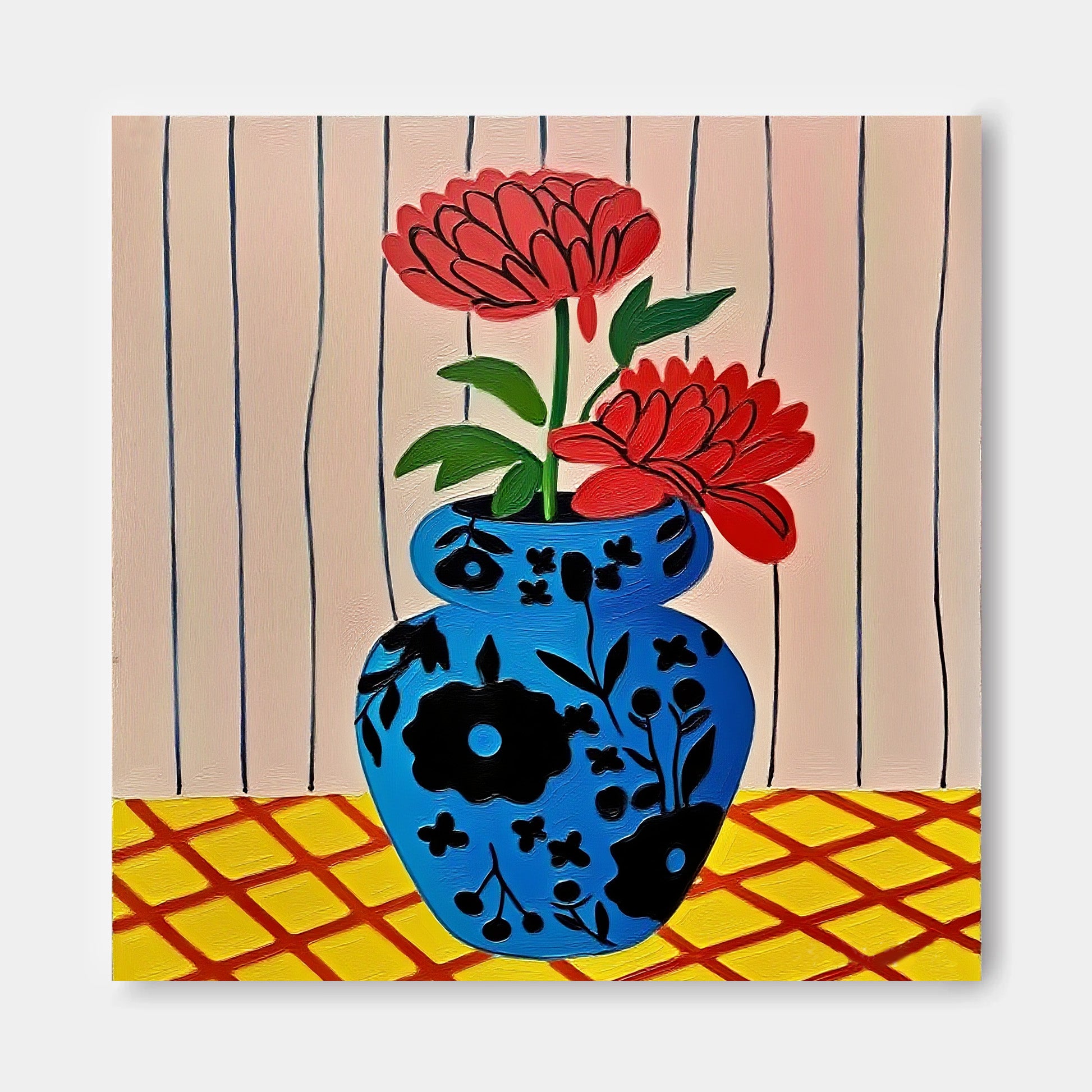 A blue vase with red flowers is placed on a yellow and red checkered surface against a striped background.