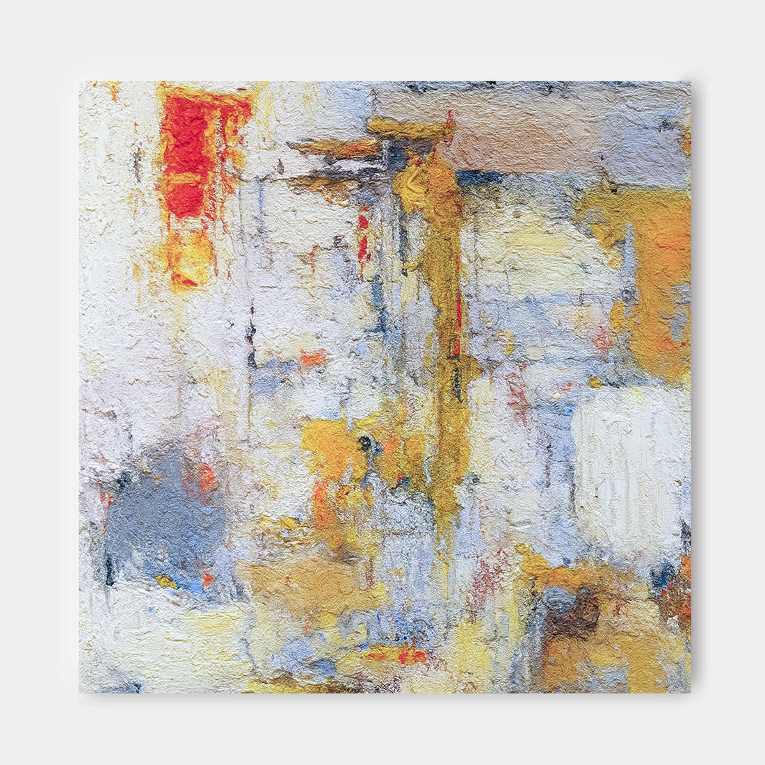 The image is an abstract painting with a vibrant mix of colors, including red, yellow, blue, and white, creating a dynamic and energetic composition.