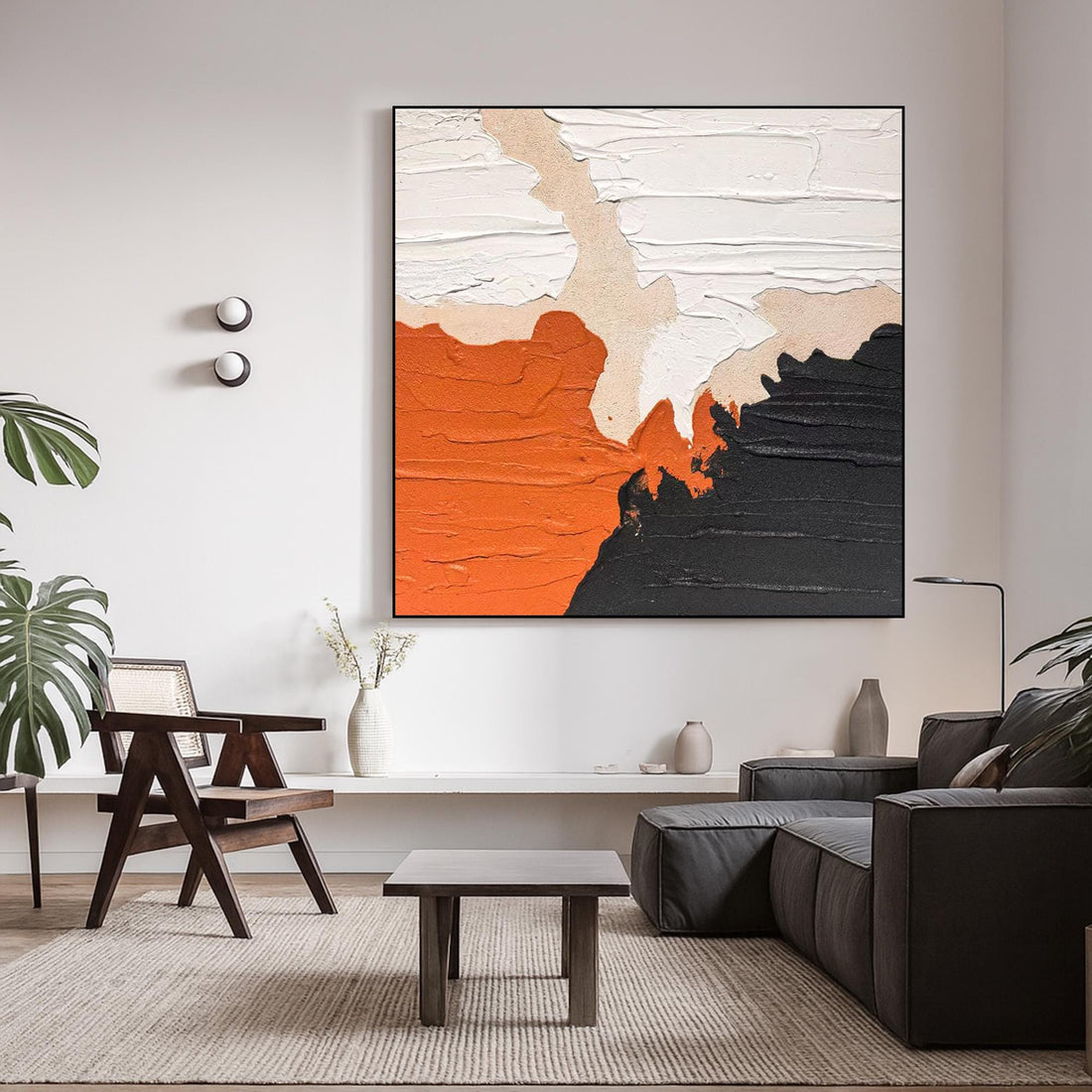 The image is an abstract painting featuring a combination of orange, black, and white colors. The painting has a textured appearance, with visible brushstrokes and layers of paint.