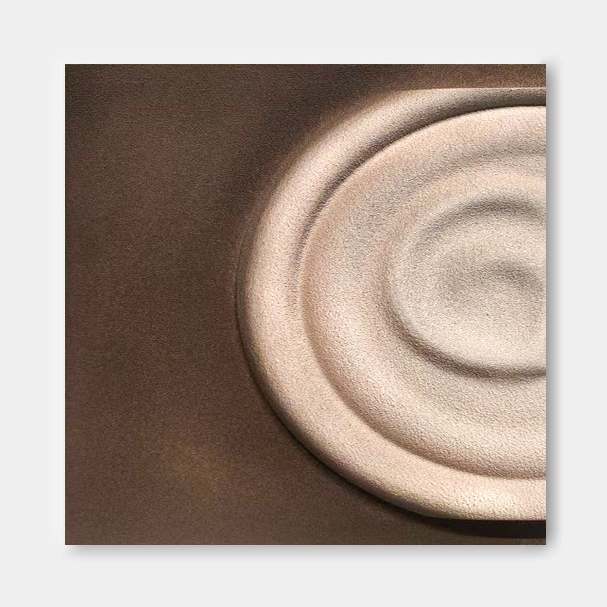 a close-up view of a circular object, possibly a plate or a bowl, with a textured surface.