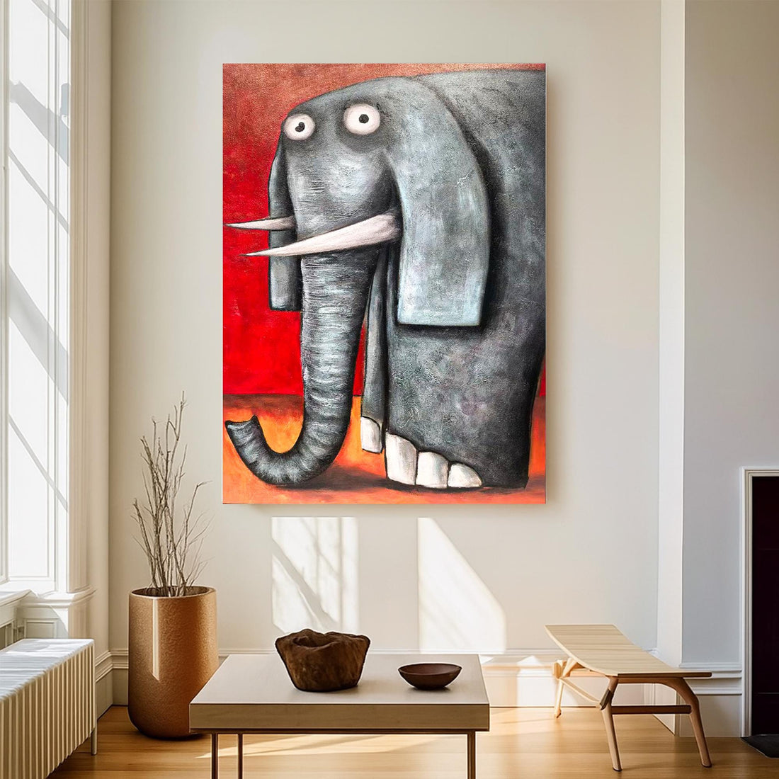 a large gray elephant with large white tusks, standing against a red background.