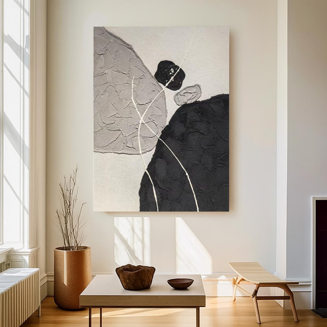 The image is a black and white abstract painting featuring a large black shape in the center, surrounded by smaller black shapes and lines.