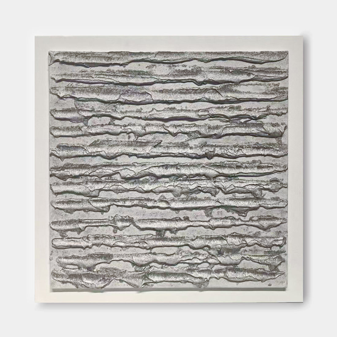 The image is a square-shaped abstract artwork with a textured, metallic appearance. The artwork features a repeating pattern of lines and curves, creating a sense of movement and depth.