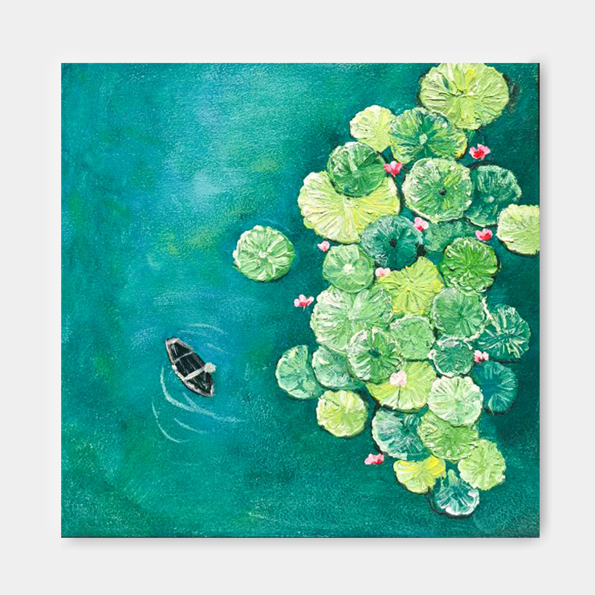 a small boat floating on a body of water, surrounded by a lush display of green lily pads and pink flowers.