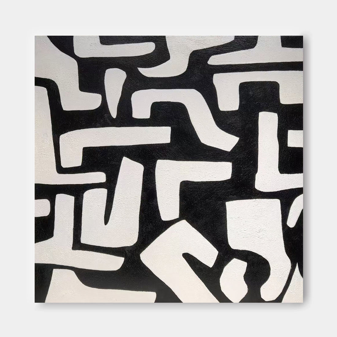 The image is a square with a black and white abstract pattern composed of various shapes and lines.