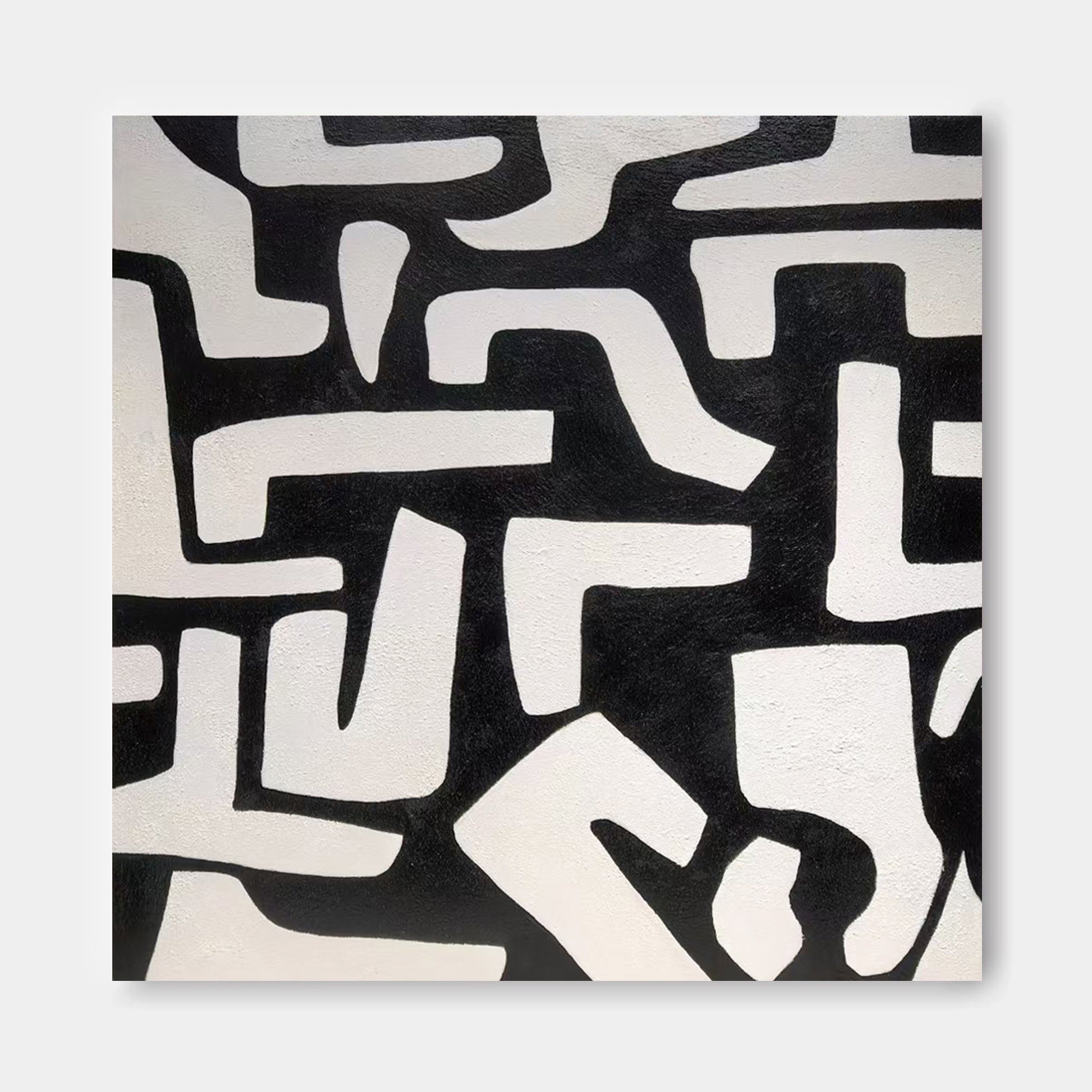 The image is a square with a black and white abstract pattern composed of various shapes and lines.
