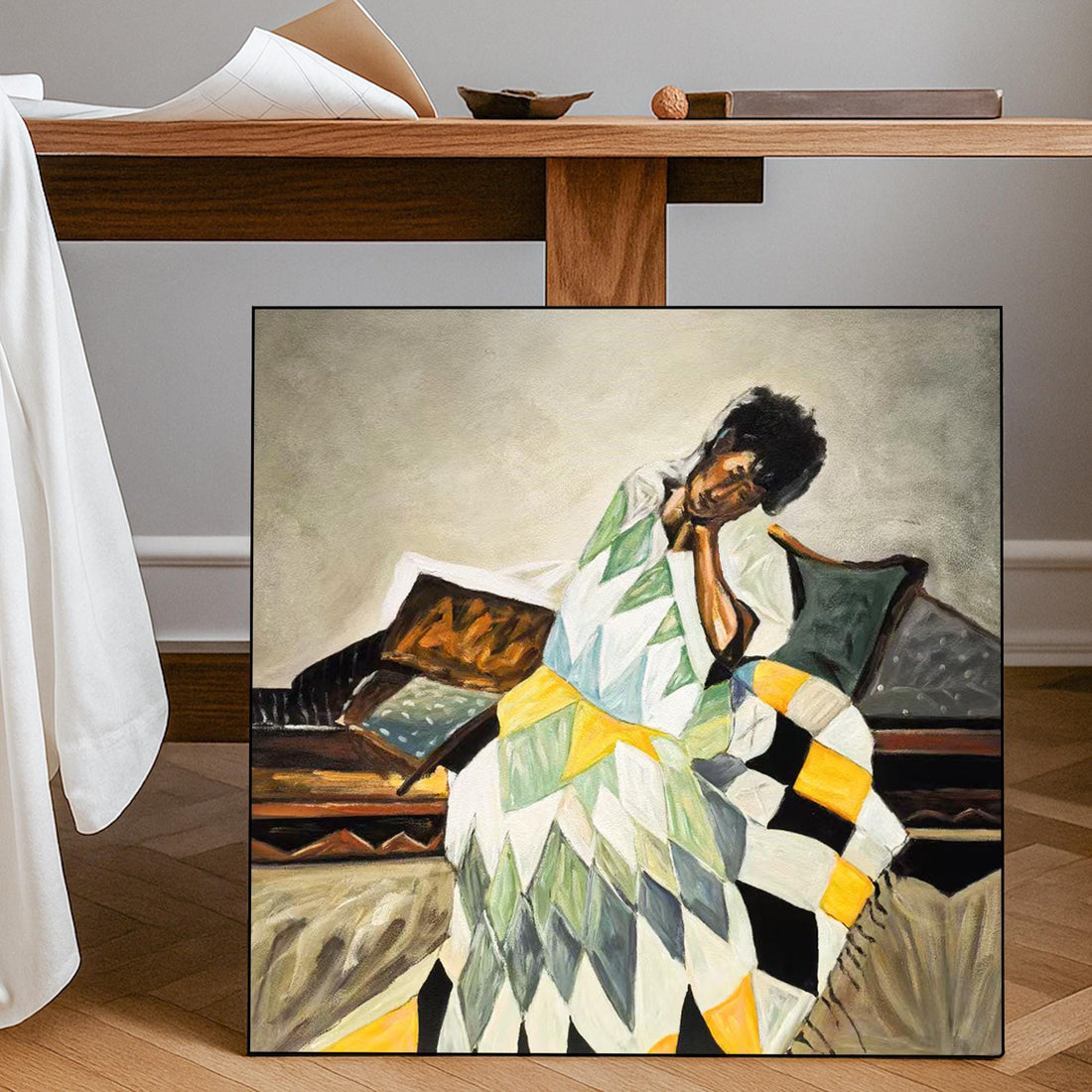 The image is an oil painting depicting a woman sitting on a bench, wearing a colorful, geometric-patterned dress.