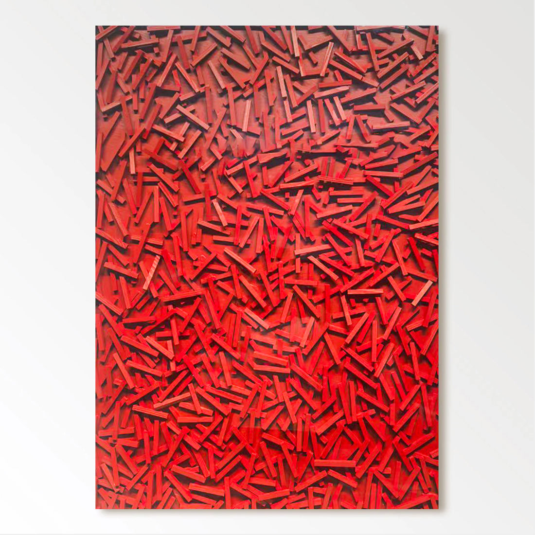 The image is a vibrant, abstract artwork composed of numerous red and orange shapes, creating a visually striking and dynamic composition.