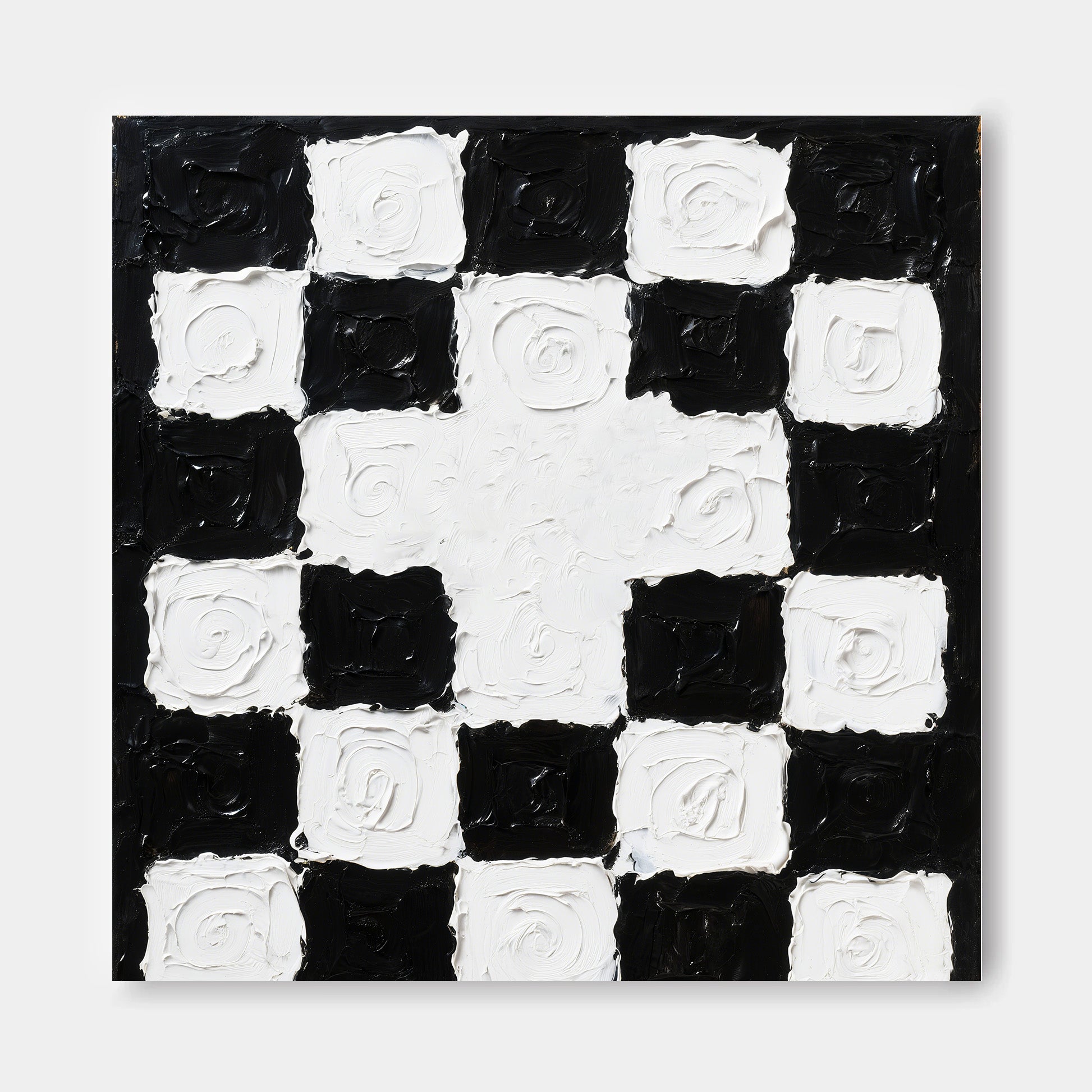 The image is a black and white checkered pattern with a central white square surrounded by smaller black squares.