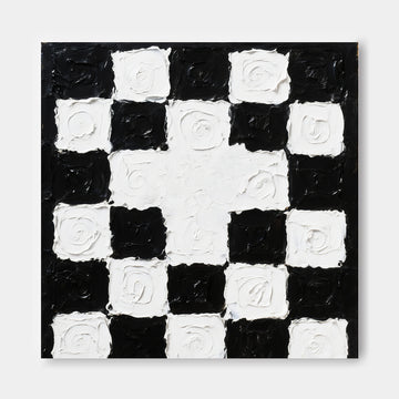 The image is a black and white checkered pattern with a central white square surrounded by smaller black squares.