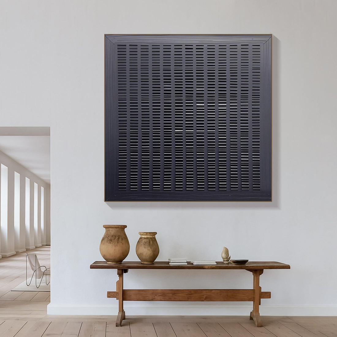 The image is a square-shaped object with a grid-like pattern of vertical lines, creating a visually striking and abstract design.