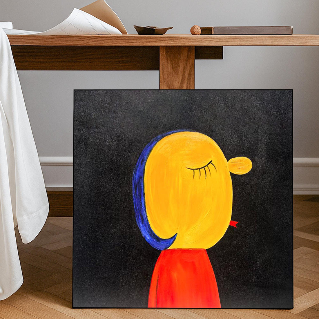 The image is a painting of a yellow character with a red shirt, set against a black background.