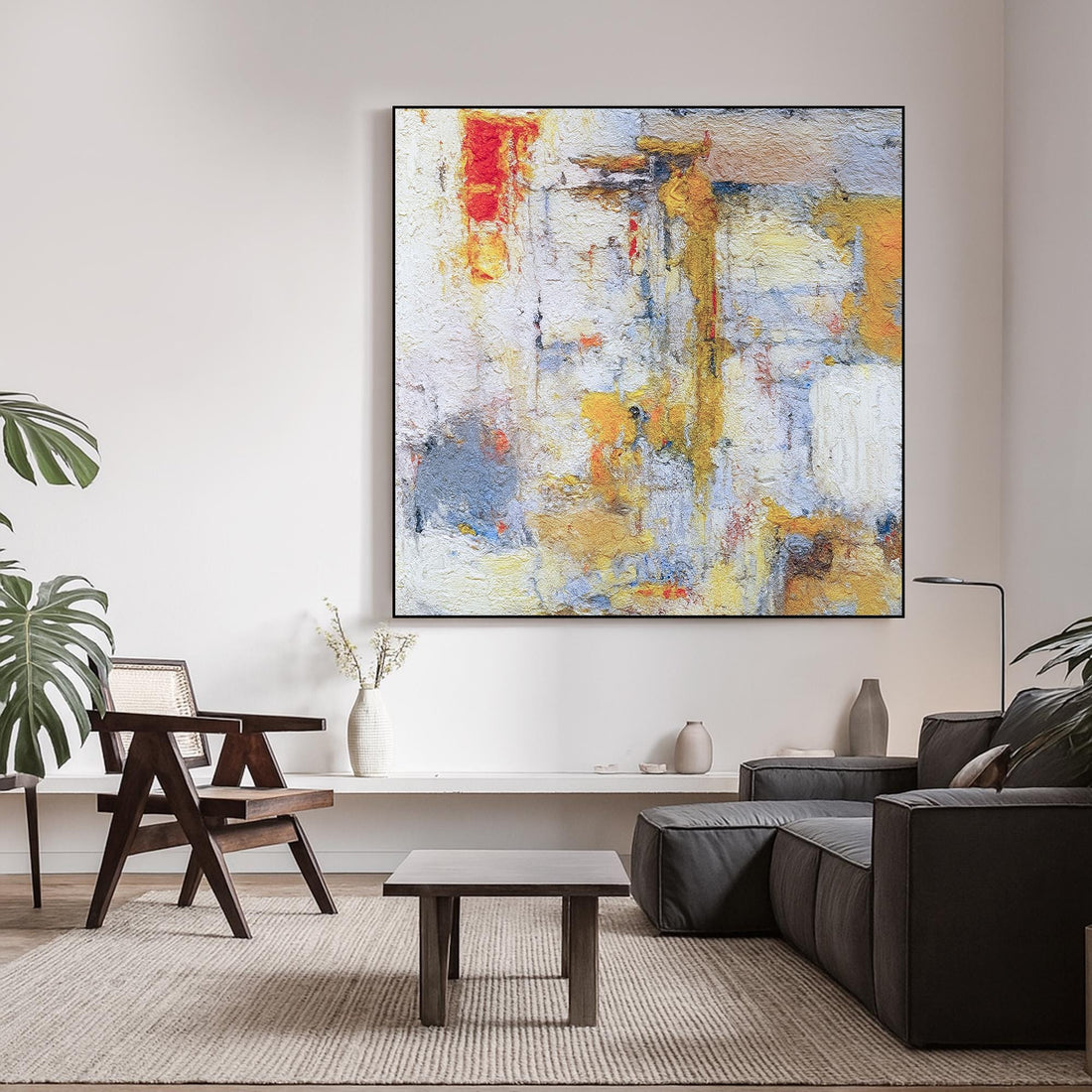 The image is an abstract painting with a vibrant mix of colors, including red, yellow, blue, and white, creating a dynamic and energetic composition.