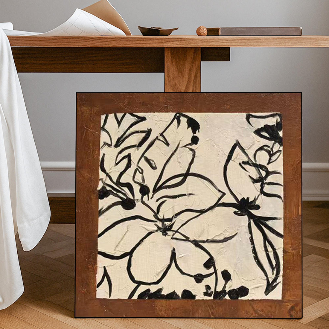 The image is a square painting featuring abstract floral designs in black and white.