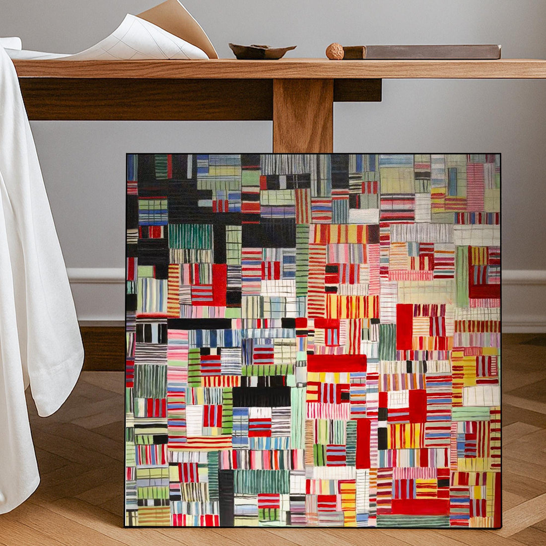 The image is a vibrant and colorful abstract artwork composed of various geometric shapes and patterns in a variety of bold colors, including red, green, yellow, blue, and black.