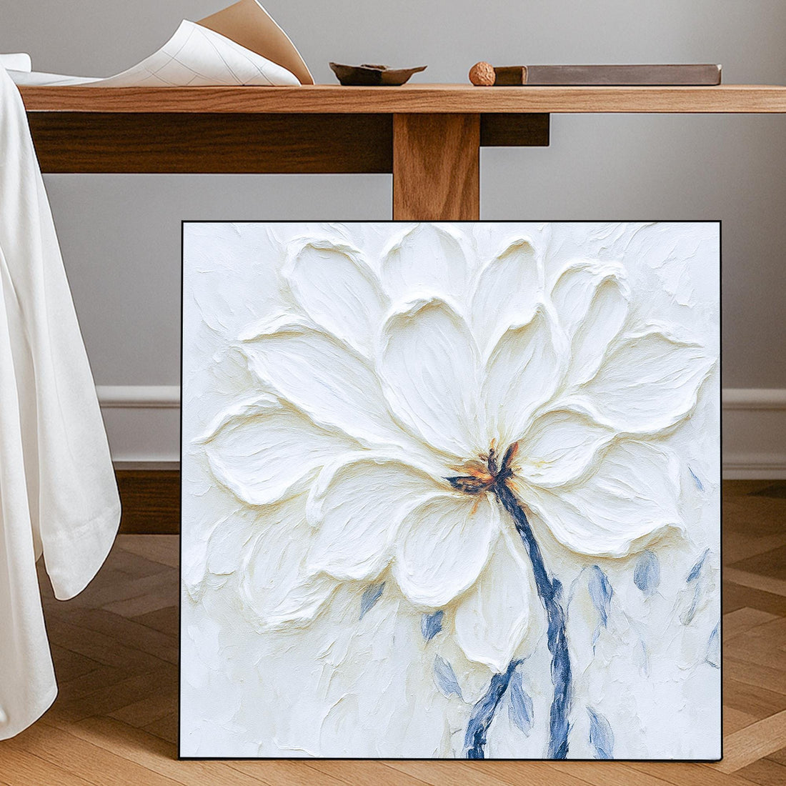 The image is a painting of a large white flower with delicate petals and a small brown center.